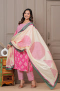 Women wearing a pink floral handblock printed kurta with matching patterned pants and a cream-colored printed dupatta with green borders.